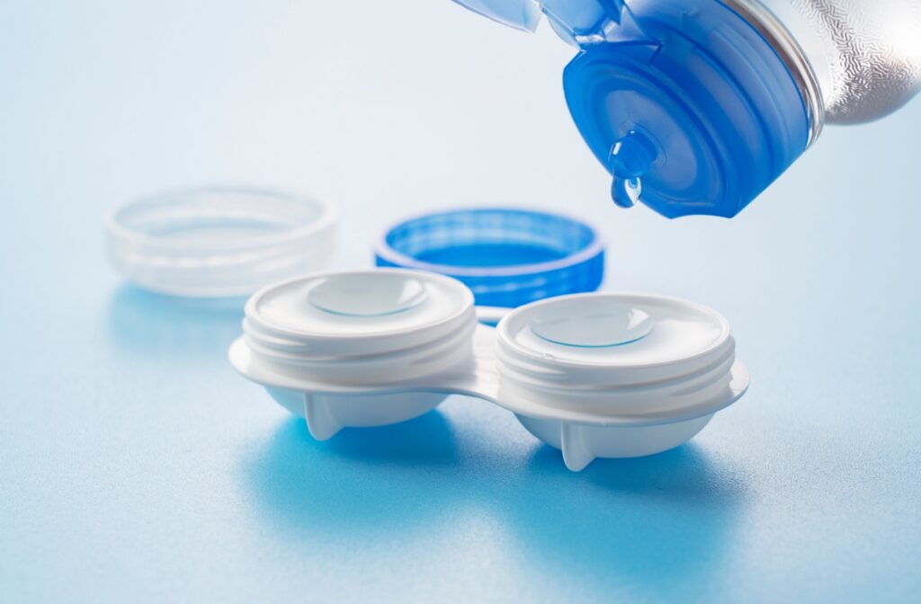 a contact lens case with contact lenses being applied with saline