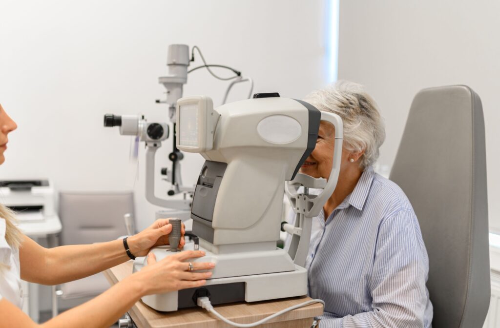 An adult having their eyes tested for vision problems by an optometrist.