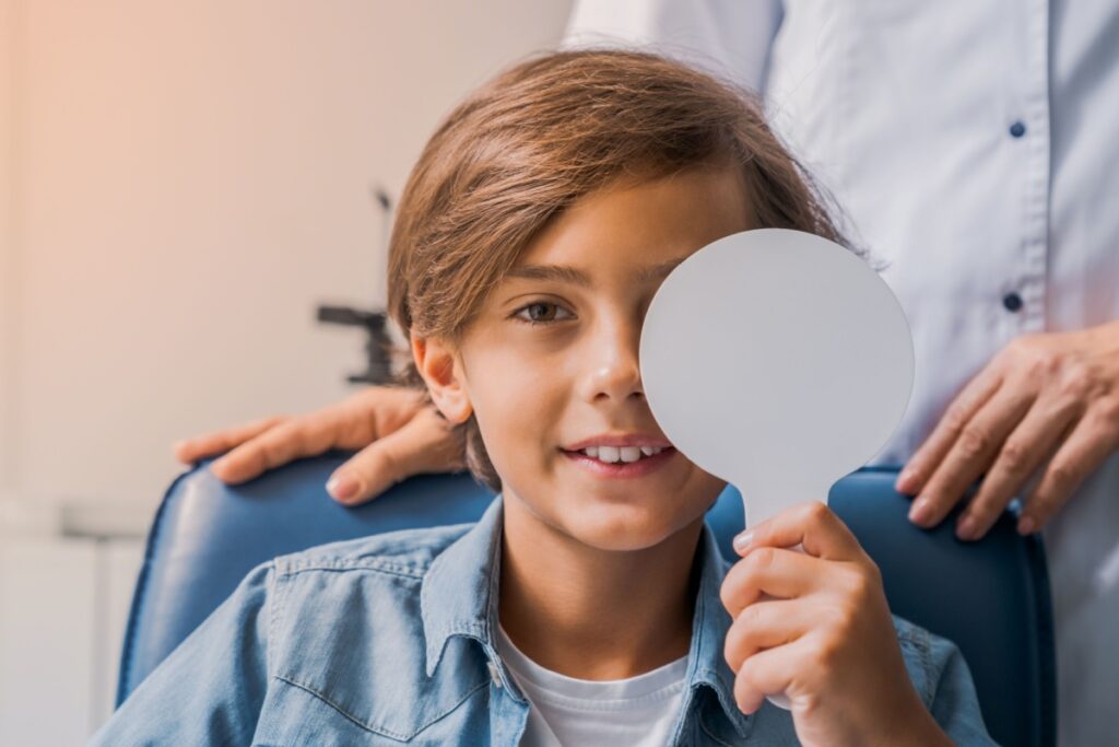 A child at their optometrist's office being assessed for myopia.